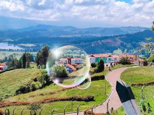 a bubble in the air on top of a hill at Santelmo Casa Hotel Boutique in Paipa +5 photos