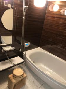 Kylpyhuone majoituspaikassa 島宿糸
