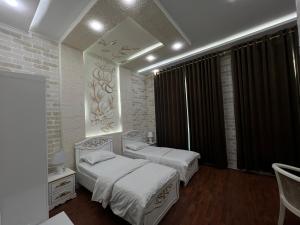 Postel nebo postele na pokoji v ubytování Ideal Hotel