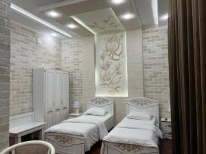 Postel nebo postele na pokoji v ubytování Ideal Hotel