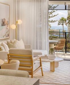 a living room with a couch and a table at Vue Broadbeach in Gold Coast