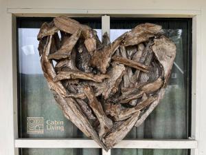 a heart made out of drift wood on a window at Nice apartment with Sauna and ski in out Trysil in Trysil