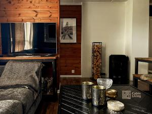 a living room with a couch and a table at Nice apartment with Sauna and ski in out Trysil in Trysil