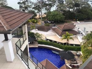 an overhead view of a house with a swimming pool at Grand Mercure Allegra Hervey Bay in Hervey Bay