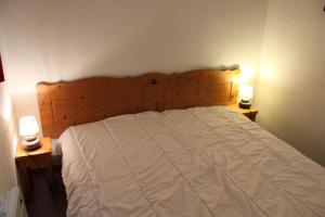 מיטה או מיטות בחדר ב-Résidence Les Chaumettes - 2 Pièces pour 6 Personnes 184