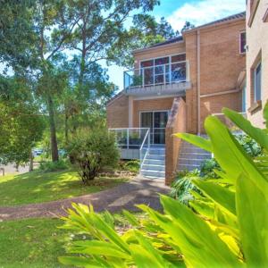 a house with a balcony on the side of it at The Sands in Mollymook