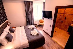 Postel nebo postele na pokoji v ubytování Hotel Yaman