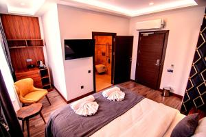 Postel nebo postele na pokoji v ubytování Hotel Yaman