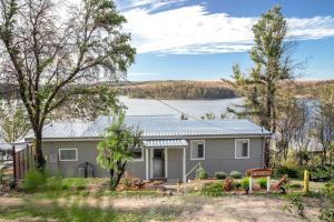 a house with a view of a lake at Home On the Water in Yatte Yattah