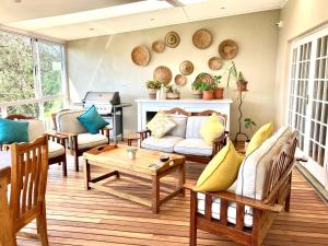 a living room with a couch and a table at Gateside Guesthouse in Hilton