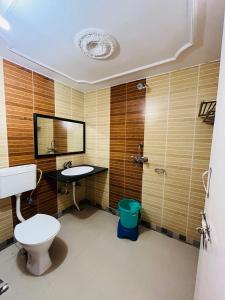 a bathroom with a toilet and a sink at The Ranthambhore Heritage in Sawāi Mādhopur