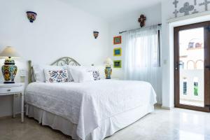 Säng eller sängar i ett rum på Royal Palms by BVR