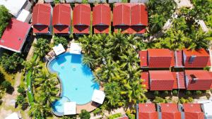 an overhead view of a resort with a swimming pool and palm trees at Fla Village in Phu Quoc