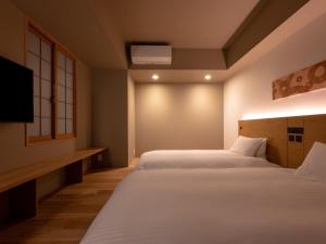 Letto o letti in una camera di MIMARU SUITES Tokyo Asakusa