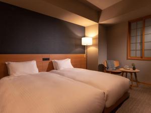 Letto o letti in una camera di MIMARU SUITES Tokyo Asakusa