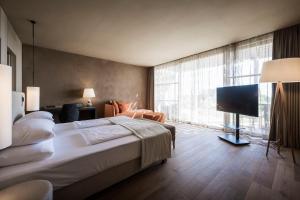 Кровать или кровати в номере ADLER Spa Resort SICILIA