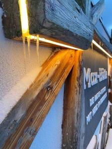 a close up of a building with ice hanging from the roof at Naturpension Max-Hütte in Breitenbrunn