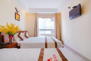 Cama o camas de una habitación en Paradise Hotel