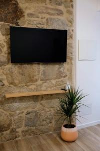 TV a/nebo společenská místnost v ubytování Lar Azul