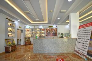 a lobby with a counter in the middle of a store at OYO 140 Al Musafir Hotel in Barka