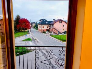 a view of a city street from a balcony at Casa Bianchi in Asiago
