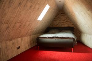 a bedroom with a bed in a brick wall at Apartment Alma in Quedlinburg