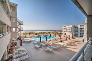 an overhead view of a swimming pool and the beach at Beachfront Studio Apartment with Community Pool in Ventnor City