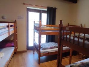 A bed or beds in a room at Albergue La Senda