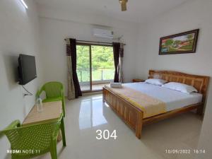 Hotel Kavijay Sea View客房内的一张或多张床位