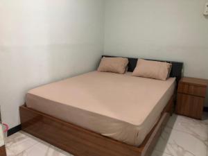 Postel nebo postele na pokoji v ubytování Bening Asri Guesthouse