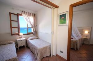 Postel nebo postele na pokoji v ubytování Hotel Barsalini
