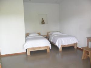 Llit o llits en una habitació de Ju'Blu Hotel