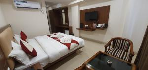 Postel nebo postele na pokoji v ubytování Hotel MK Grand