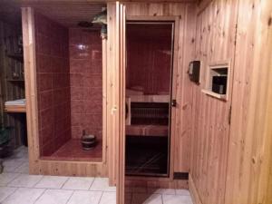 a shower with a glass door in a bathroom at JustB in Riemst