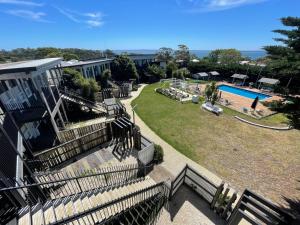 a resort with a swimming pool and a yard at The Sea Pavilions in Cowes