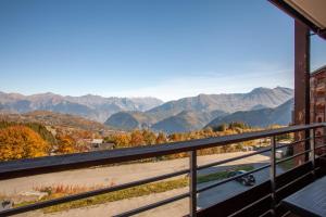 a view of the mountains from the balcony of a house at Le Corbier de Colette in Villarembert