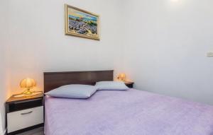 Posteľ alebo postele v izbe v ubytovaní Apartmani Ivanković
