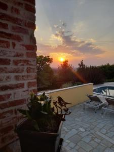 The sunrise or sunset as seen from a vendégházakat or nearby