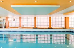 a swimming pool in a building at Hotel Lyskirchen in Cologne