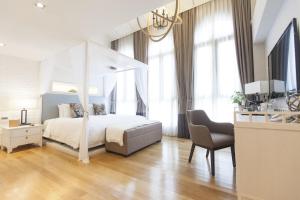 Rúm í herbergi á Hotel NuVe Heritage