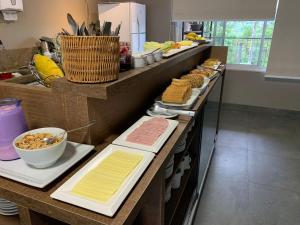 a buffet line with different types of food on it at Pousada Choppão in Feliz