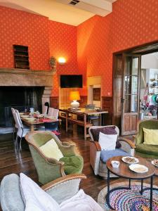 a living room filled with furniture and a fireplace at Les Gîtes de Roz-Maria in Quintin