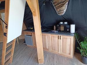 a small kitchen in a yurt with a counter at Luxury Glamp in Bańska Niżna