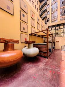 a room with two vases on the floor of a building at The Gold Hut in Johannesburg