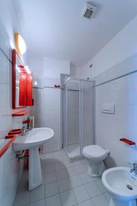 a bathroom with a shower and a sink and a toilet at Residence Dolcemare in San Benedetto del Tronto