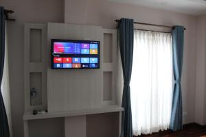 TV o dispositivi per l'intrattenimento presso Hotel Mega & Apartment