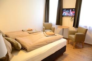 Postel nebo postele na pokoji v ubytování Apartment Haus Van der Leij