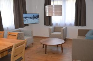 TV a/nebo společenská místnost v ubytování Apartment Haus Van der Leij