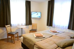 Postel nebo postele na pokoji v ubytování Apartment Haus Van der Leij