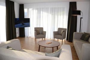 TV a/nebo společenská místnost v ubytování Apartment Haus Van der Leij